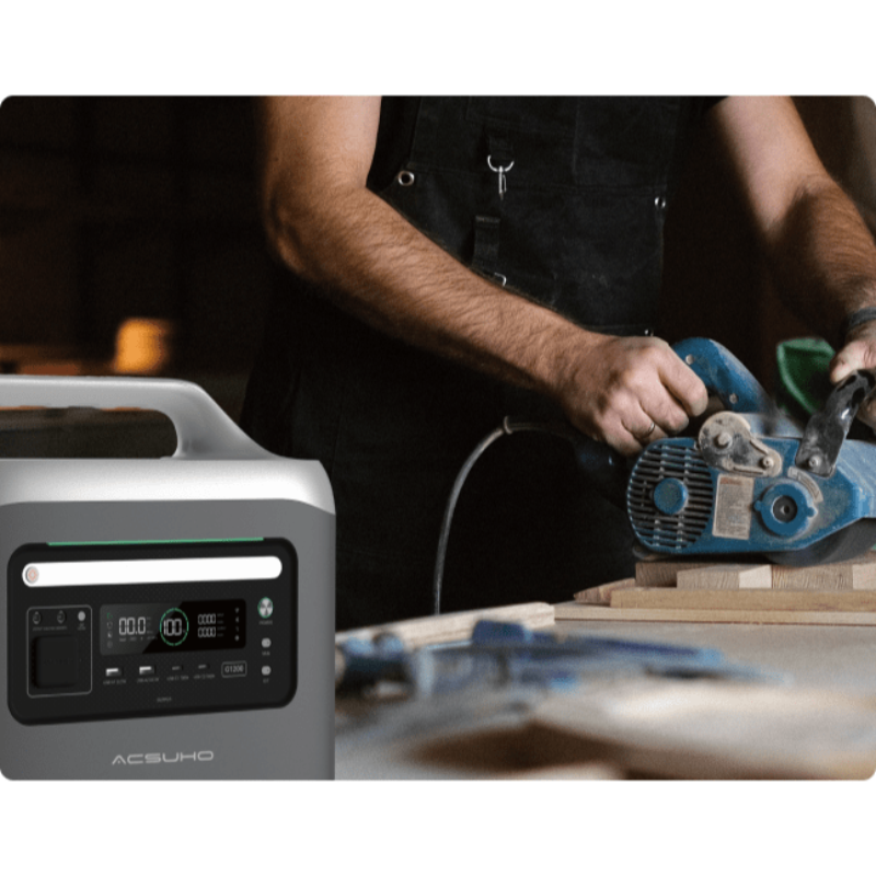 Person using a power tool with an Aeon Guardians G1200 portable power station in the foreground