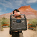 Jackery Explorer 300 Plus Portable Power Station being held by a woman.