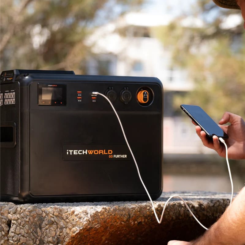 iTechworld Premium GoFurther Dual Battery System with iTECHDCDC40 Battery Charger and iTECH160X PRO Lithium Battery with Bluetooth - battery kit attached connected to a smartphone.