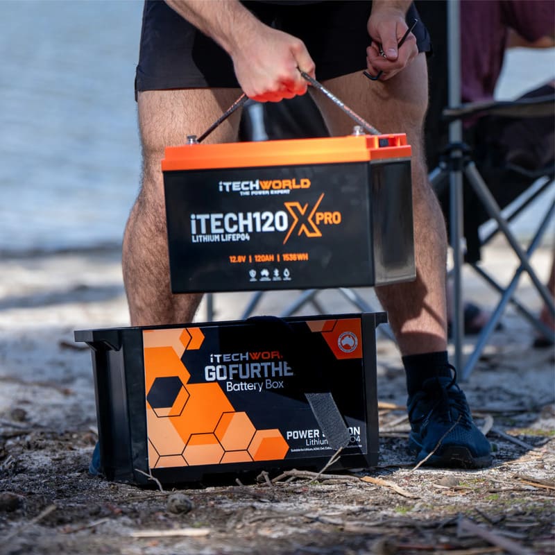 iTechworld iTECH120X PRO Deep Cycle Lithium Battery with Bluetooth LiFePO4 120Ah being held by a man.