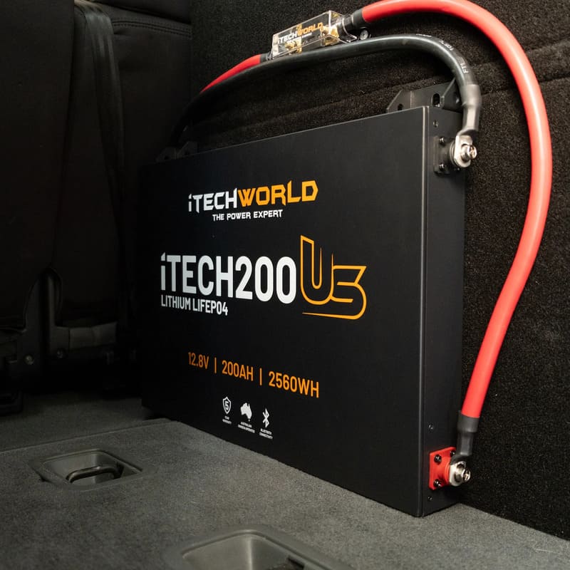 iTechworld iTECH200US Ultra Slim Deep Cycle Lithium Battery with Bluetooth LiFePO4 200Ah - battery attached inside a car.